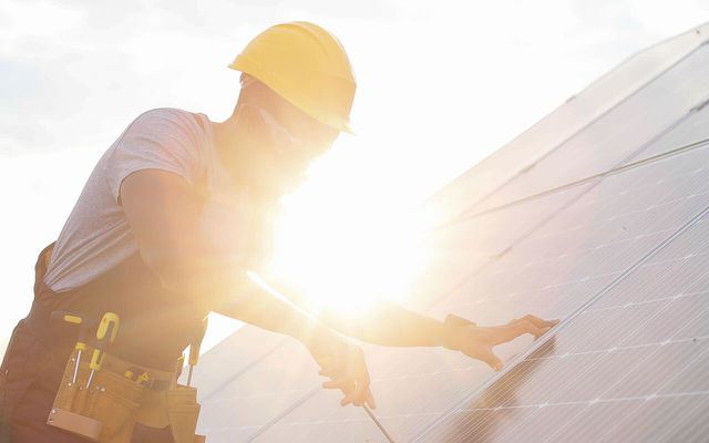 Solar-panel-worker-outside.jpg